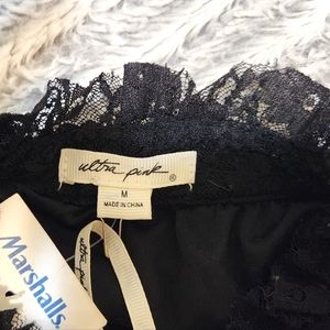 Long sleeve, laced black top.